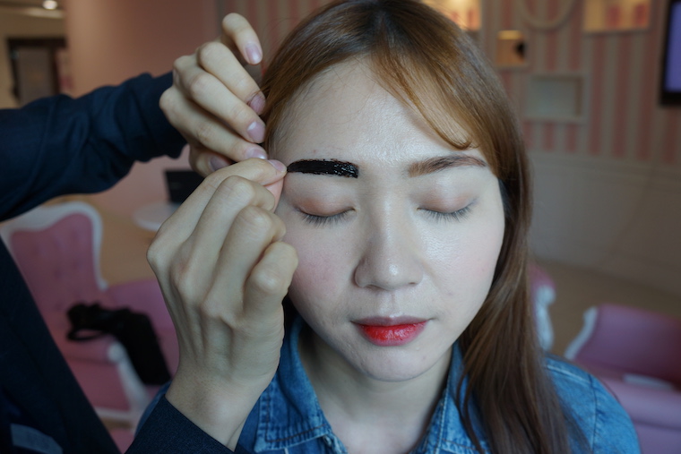 Famous esthetician Charlotte Cho tries the semi-permanent Tint My Brows Gel from Etude House on left brows