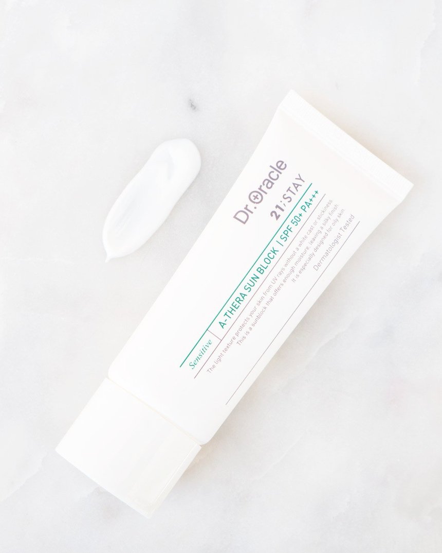 A tube of Dr Oracle's A-Thera Sunblock SPF 50 On Top A White Background